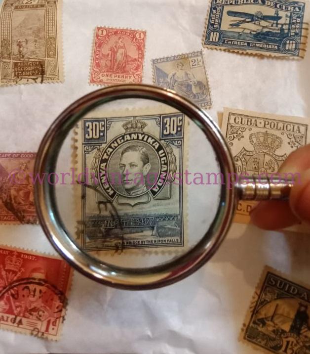Magnifying glass and postage stamps
